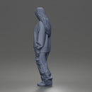 Girl Standing In Oversized Sweatshirt Cargo Pants And Sneakers
