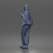 hijabi woman sipping takeaway drink in modern casual streetwear style - Only-Games