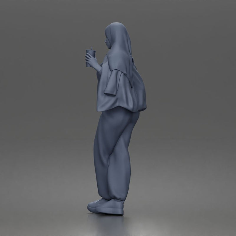 hijabi woman sipping takeaway drink in modern casual streetwear style - Only-Games