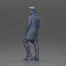 Man in brown coat glances sideways dressed in stylish winterwear - Only-Games