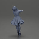 Girl in dress leaning back holding hands enjoying a playful dance moment - Only-Games