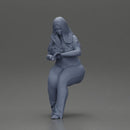 Blonde woman in red top white pants sitting applies hand cream - Only-Games