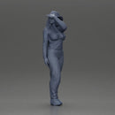 woman in red pants striking stylish pose with hat - Only-Games