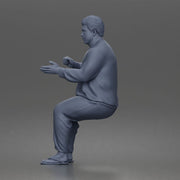 Asian Man sits gesturing while wearing casual sweater pants flip flops comfortably - Only-Games