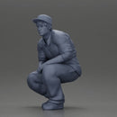Gangster man crouching in a relaxed pose wearing casual clothing and cap - Only-Games