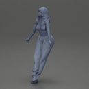 Woman sitting on car in red top yellow pants striking playful pose - Only-Games