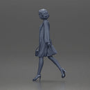 Woman with curly hair wearing red coat walking holding red handbag - Only-Games