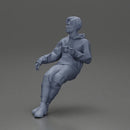 Casually sitting, holding a cup, enjoying a peaceful moment - Only-Games