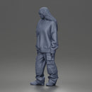 Girl Standing In Oversized Sweatshirt Cargo Pants And Sneakers