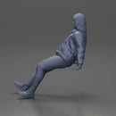 Man with long hair wearing brown jacket sitting with relaxed posture - Only-Games