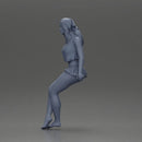 Stylish woman sitting casually in a white top and blue skirt - Only-Games