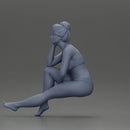 Woman sitting in Blue Bikini Ponders with Relaxed Posture - Only-Games