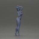 Stylish woman confidently posing in red bikini and white cap - Only-Games