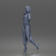Woman poses thoughtfully lifting heel wearing halter jumpsuit with platform heels - Only-Games