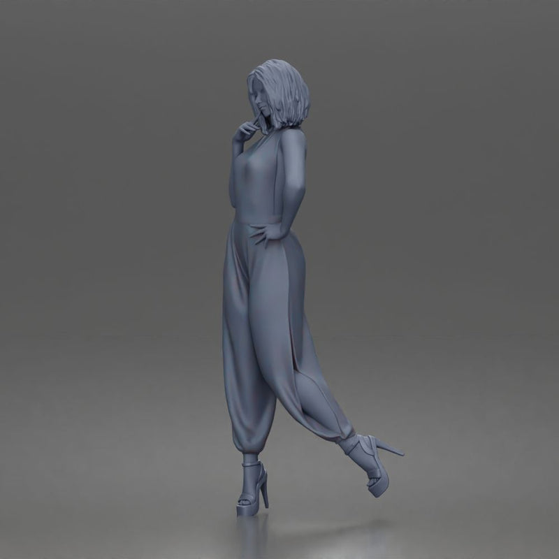 Woman poses thoughtfully lifting heel wearing halter jumpsuit with platform heels - Only-Games