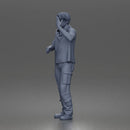 Man Standing With Handgun And Peace Sign In T-Shirt Scarf Cargo Pants And Boots