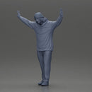 Man wearing hoodie and beanie raises hands looking happy in relaxed stance - Only-Games