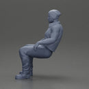 Muscular Bearded Man in Beanie Vest Pants Sitting Casually Relaxed - Only-Games