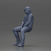 Man in Casual Sweater and Sneakers Sitting with Relaxed Posture - Only-Games
