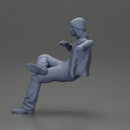 Man in a black beanie sitting and smoking a cigar - Only-Games