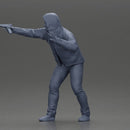 Man in hoodie pointing gun while raising hand in defensive gesture - Only-Games