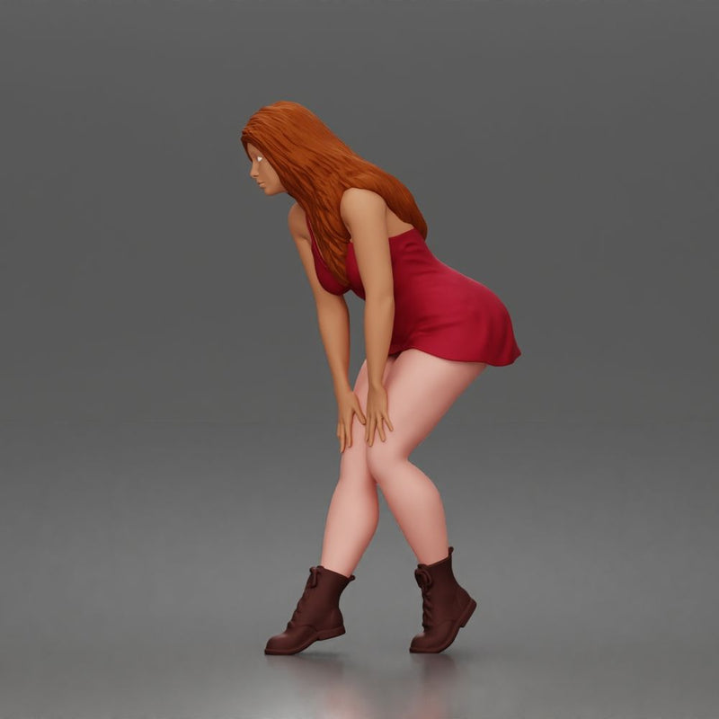 woman bending forward thoughtfully balancing gracefully in mini dress and boots - Only-Games
