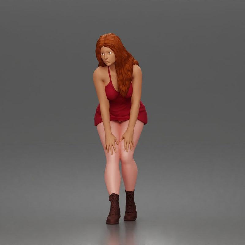 woman bending forward thoughtfully balancing gracefully in mini dress and boots - Only-Games