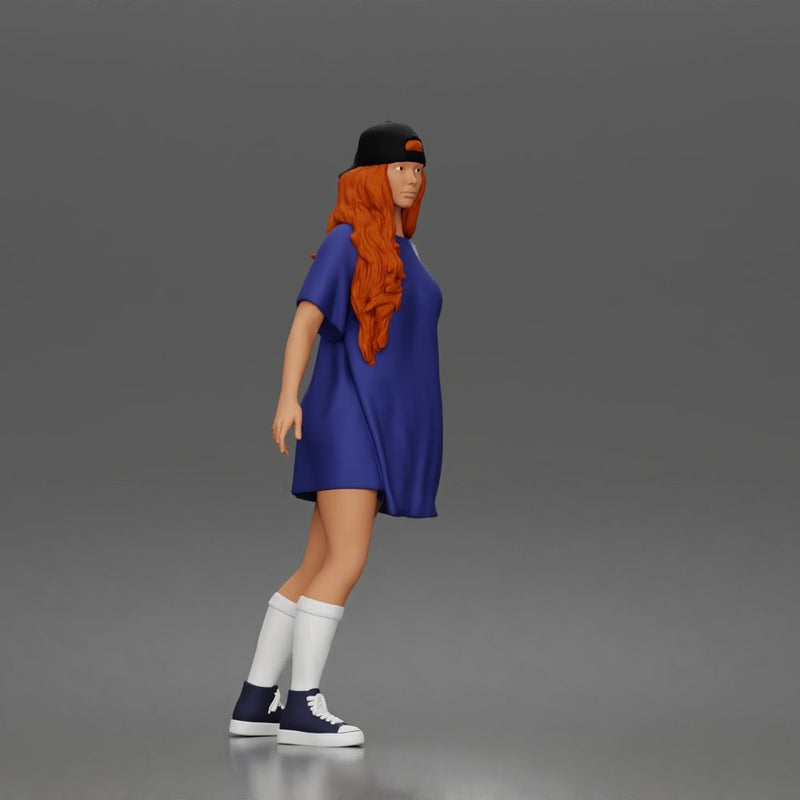 Skateboard girl in long shirt and cap gliding smoothly forward in relaxed street style pose - Only-Games