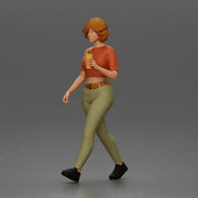 Woman strolls sipping beverage wearing crop top belted pants sneakers - Only-Games