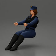 Focused officer in blue uniform driving seated holding steering wheel - Only-Games
