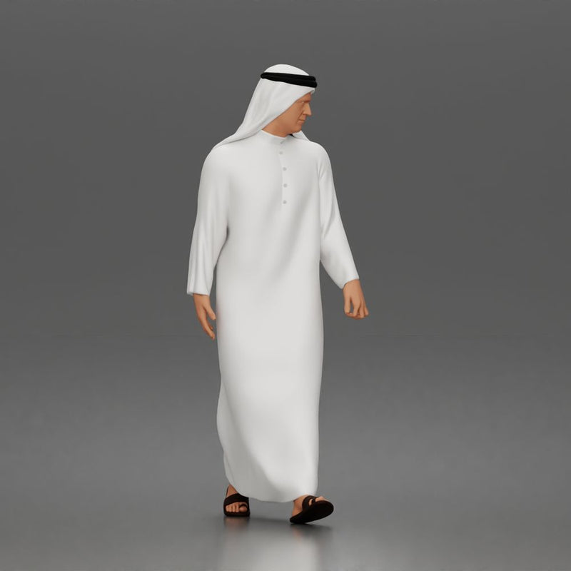 Walking man wearing thobe holding hands with woman wearing abaya