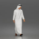 Walking man wearing thobe holding hands with woman wearing abaya