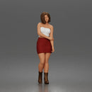 Elegant Woman Standing Gracefully Wearing Strapless Top Skirt And Boots