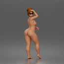 Naked standing woman shields eyes wearing sunglasses earrings flip flops