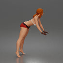 woman Pushing Tire In Bikini Top Shorts Tool Belt And Gloves