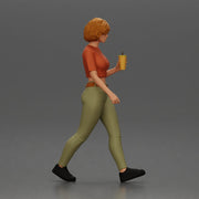 Woman strolls sipping beverage wearing crop top belted pants sneakers - Only-Games
