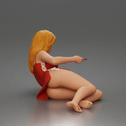 Woman lounges atop pillow watching television holding remote wearing slip dress - Only-Games