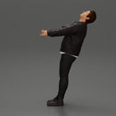 Man in jacket leaning back holding hands enjoying a playful dance moment - Only-Games