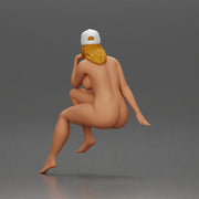 Naked Woman in Cap Sitting Thoughtfully in Relaxed Pose - Only-Games