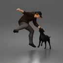 Brave Man Rescuing Dog While Wearing Casual Hoodie and Pants
