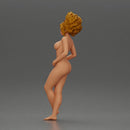 Naked woman posing confidently with voluminous hair - Only-Games