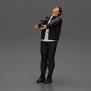 Man in jacket leaning back holding hands enjoying a playful dance moment - Only-Games