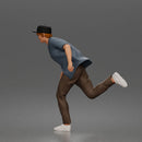 Man Riding Skateboard In Open Short Sleeve Shirt Pants And Sneakers