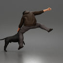 Brave Man Rescuing Dog While Wearing Casual Hoodie and Pants