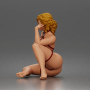 Thoughtful woman sits cross legged wearing strappy harness lingerie set - Only-Games
