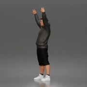 Casual protester holding blank banner wearing hoodie shorts and sneakers - Only-Games