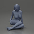 Naked Woman sitting gracefully on the floor with a relaxed pose - Only-Games