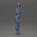 naked girl holding a phone on the beach and wearing a cap - Only-Games