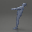 Man in jacket leaning back holding hands enjoying a playful dance moment - Only-Games