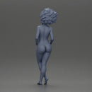 Naked woman posing confidently with voluminous hair - Only-Games